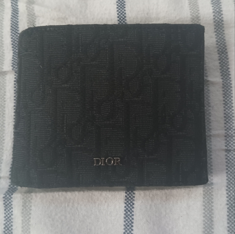 I'm selling a Oblique Jacquard canvas wallet by Christian Dior